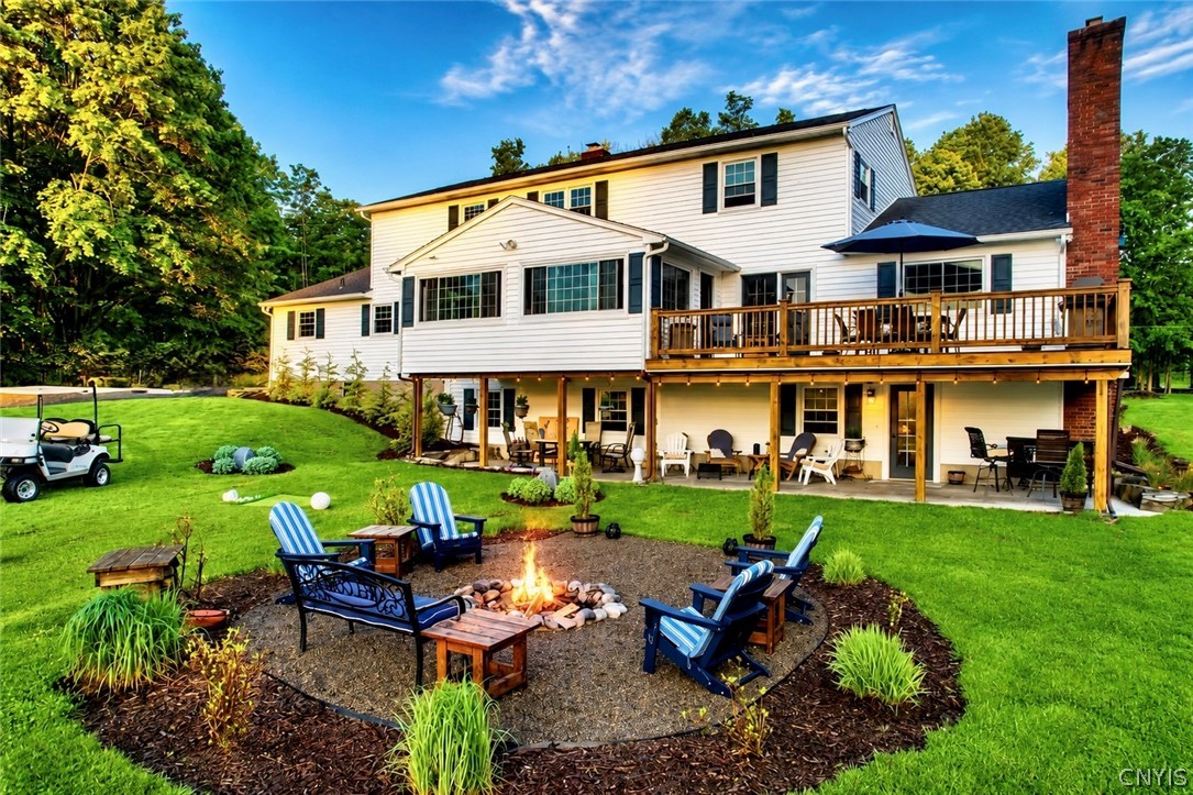 Country home with a raised deck and backyard seating